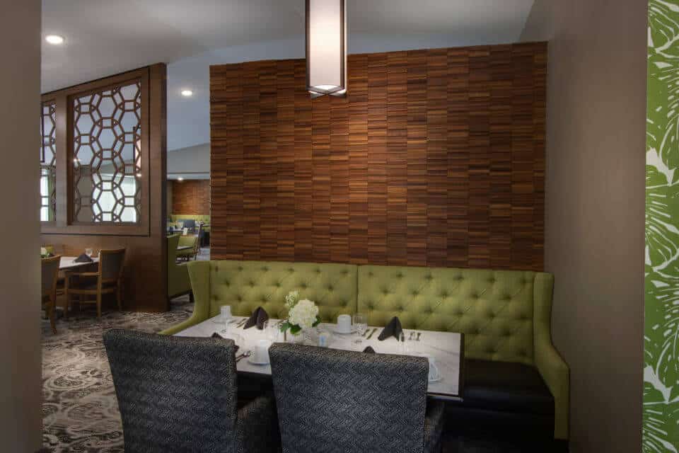 dining room with green booth, gray chairs