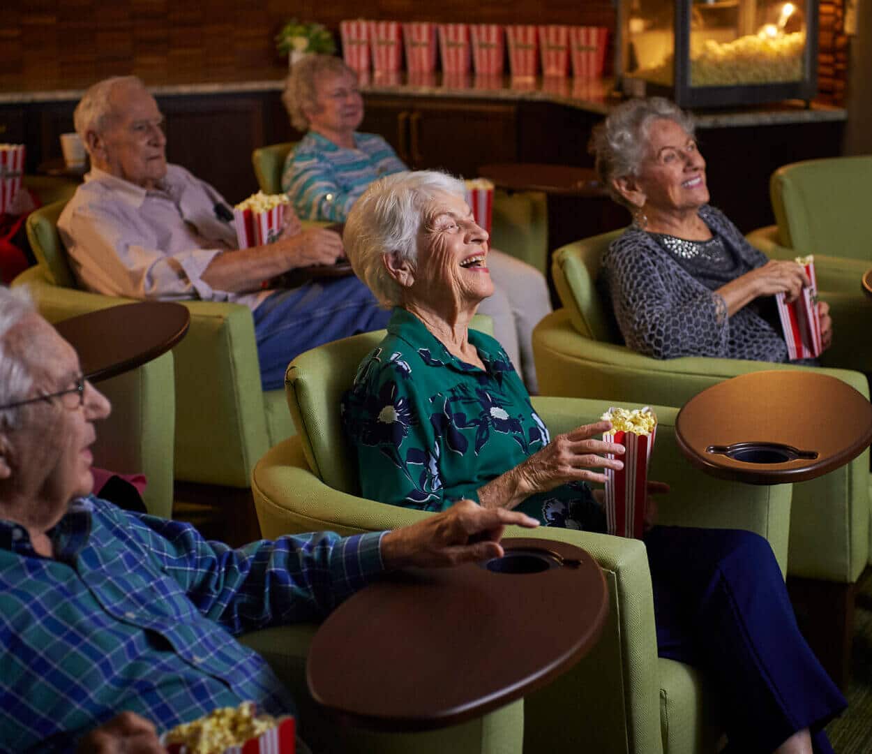 residents enjoying a movie and popcorn