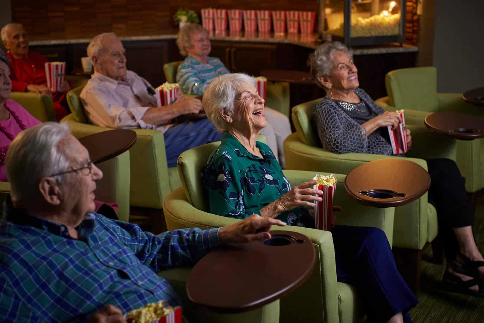 residents enjoying a movie and popcorn