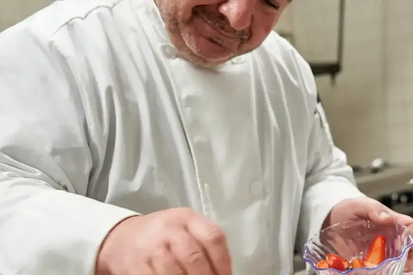 Chef Joe putting garnishes on a dessert dish